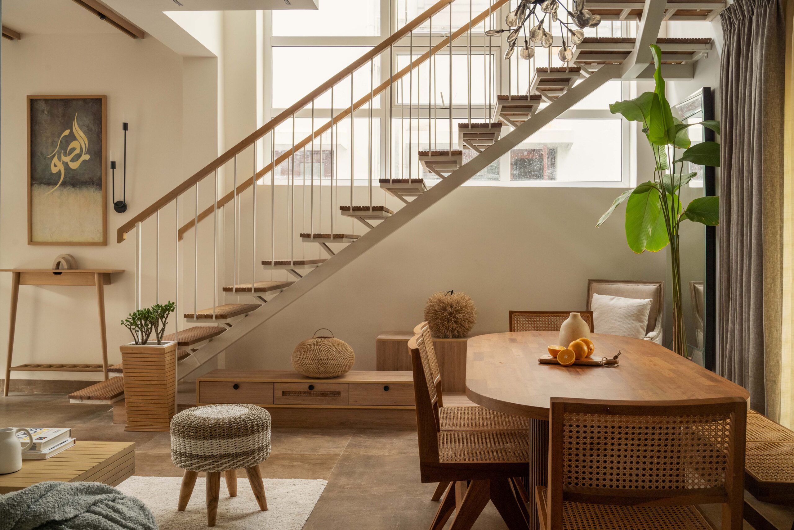 Luxury dining and staircase interior design by Canopus Design Studio, interior designers in Sarjapur Road Bangalore